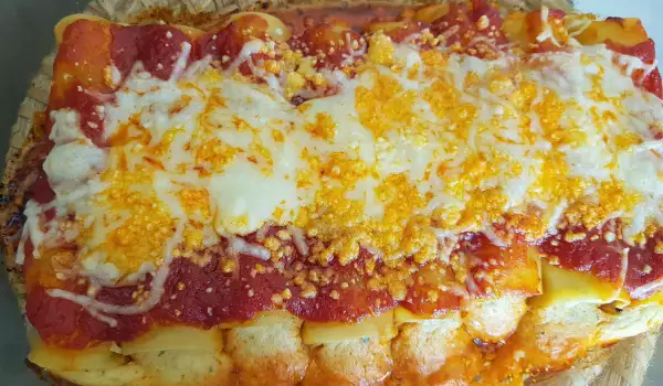 Cannelloni cu umplutură de anghinare, în sos de roșii